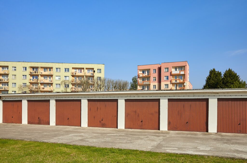 Garages with closed gates in a residential neighborhood.