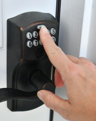 Entering key code PIN on a push button doorknob lock to unlock the door. entering a security code