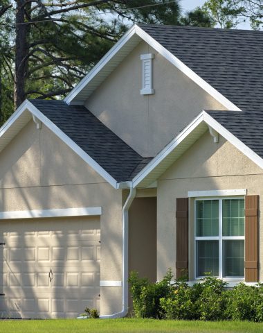 Wide garage double door and concrete driveway of new modern american house